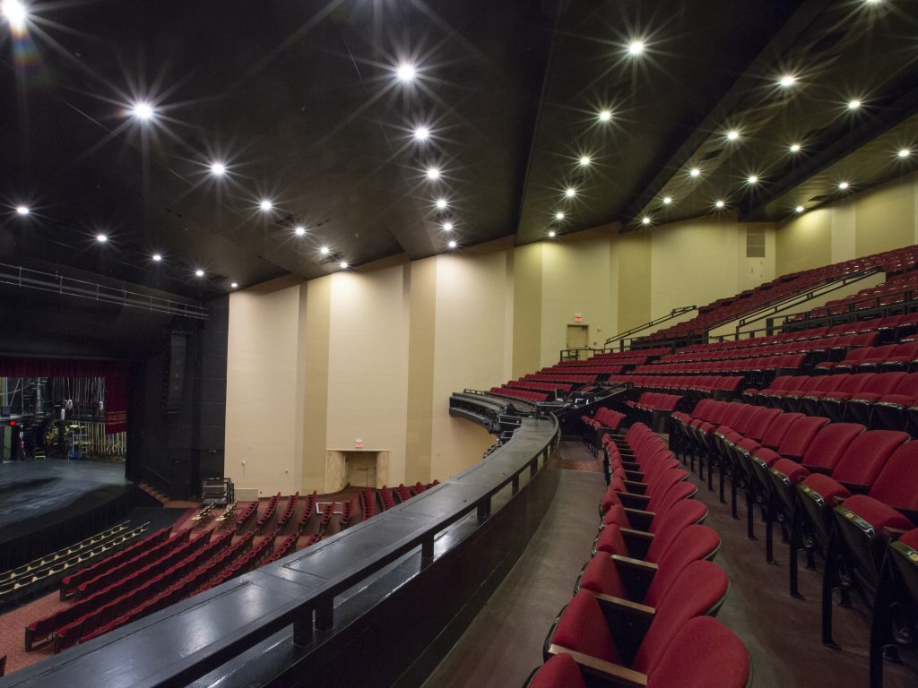 Rows of empty red seats in Jesse Auditorium