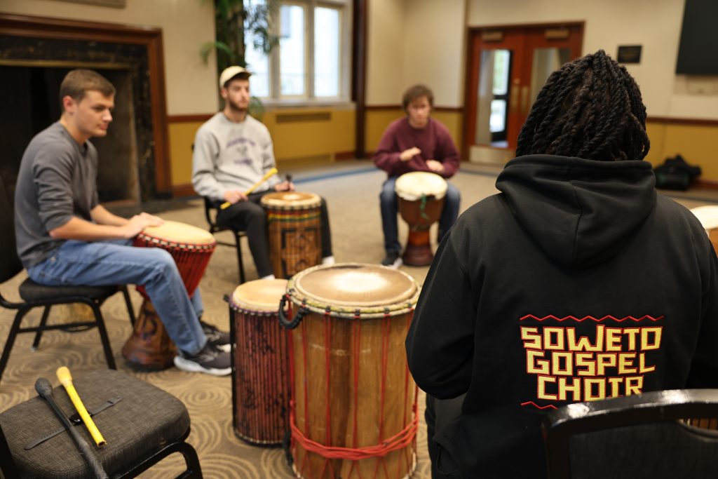 Sipho Ngcamu sits in a drum circle with  percussion students at Mizzou.
