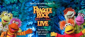 Fraggle Rock characters with their arms stretched wide open in welcome.